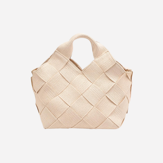 Beige woven handbag on a white background